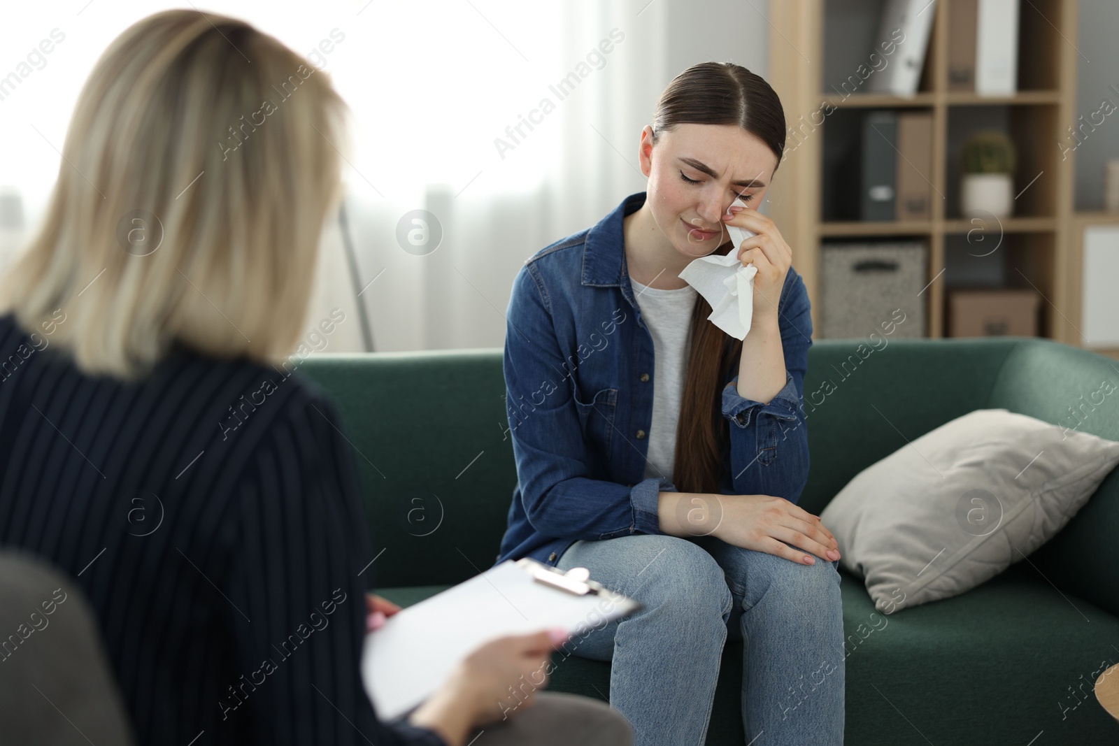 Photo of Professional psychotherapist working with patient in office