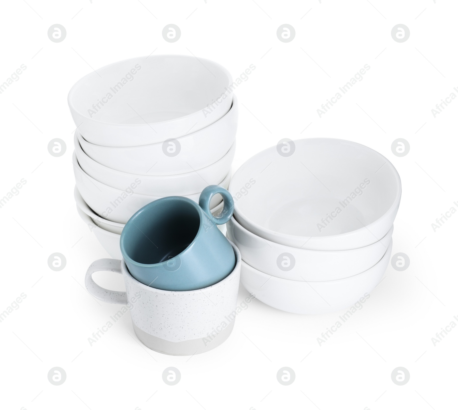 Photo of Beautiful ceramic bowls and cups isolated on white
