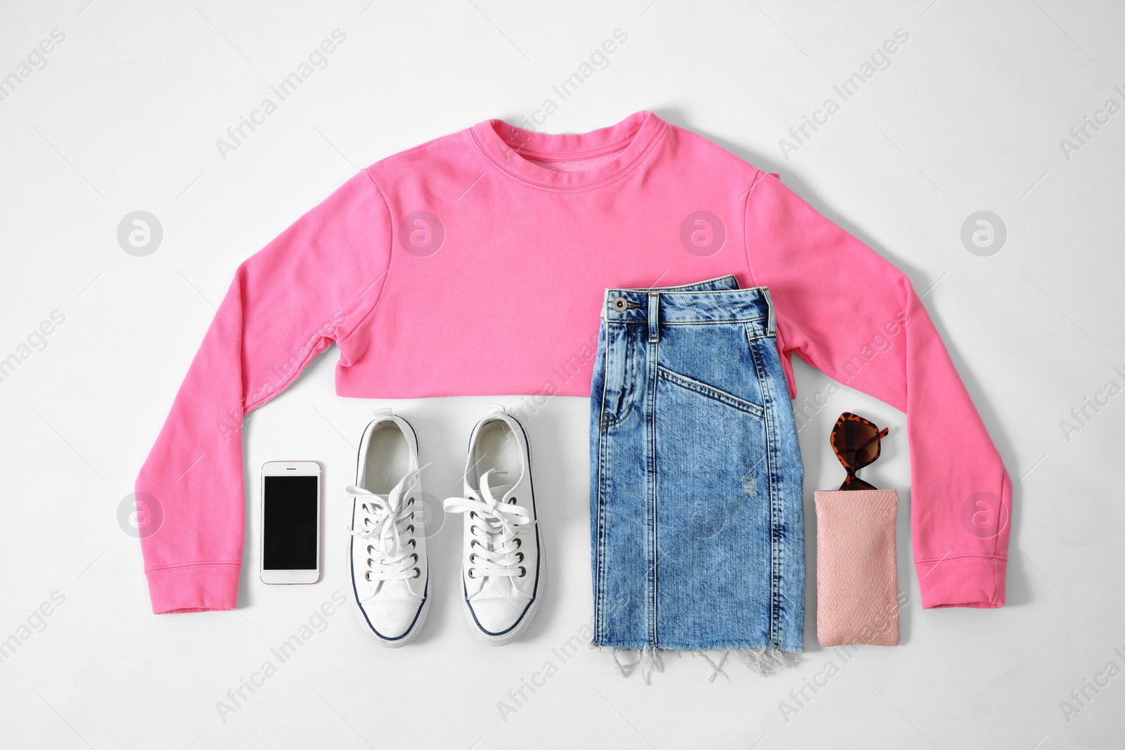 Photo of Set of trendy female clothes and accessories on light background, flat lay