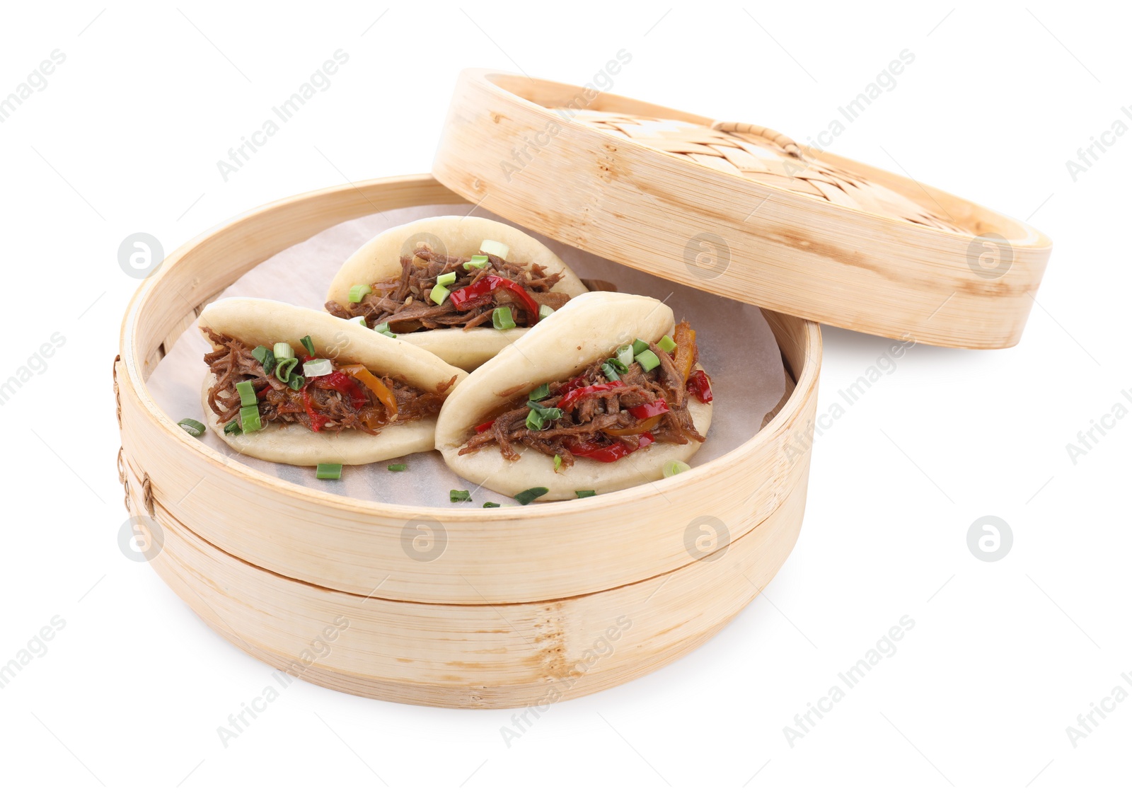 Photo of Delicious gua bao (pork belly buns) in bamboo steamer isolated on white