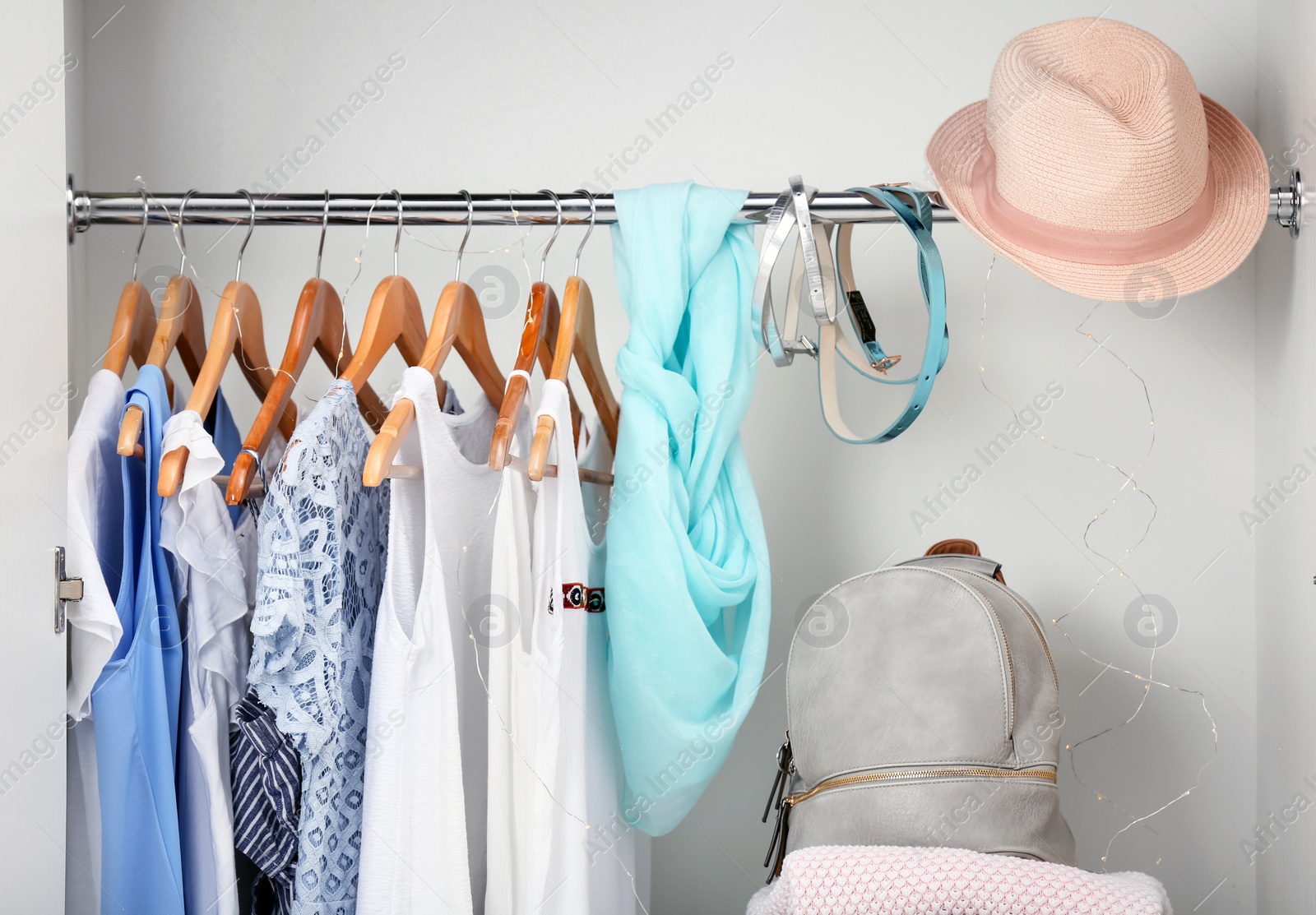 Photo of Women clothing on hangers in wardrobe