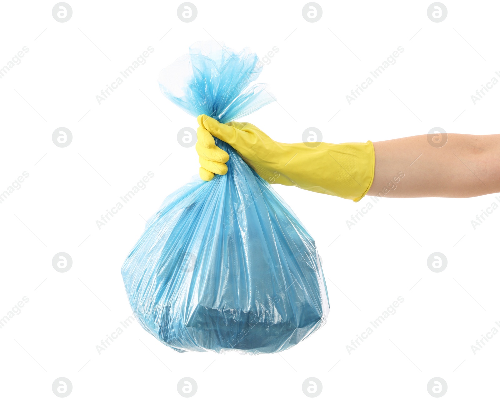 Photo of Woman holding plastic bag full of garbage on white background, closeup