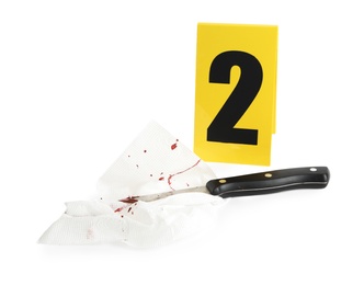 Photo of Bloody knife, napkin and crime scene marker with number two isolated on white