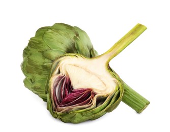Photo of Cut and whole fresh artichokes on white background