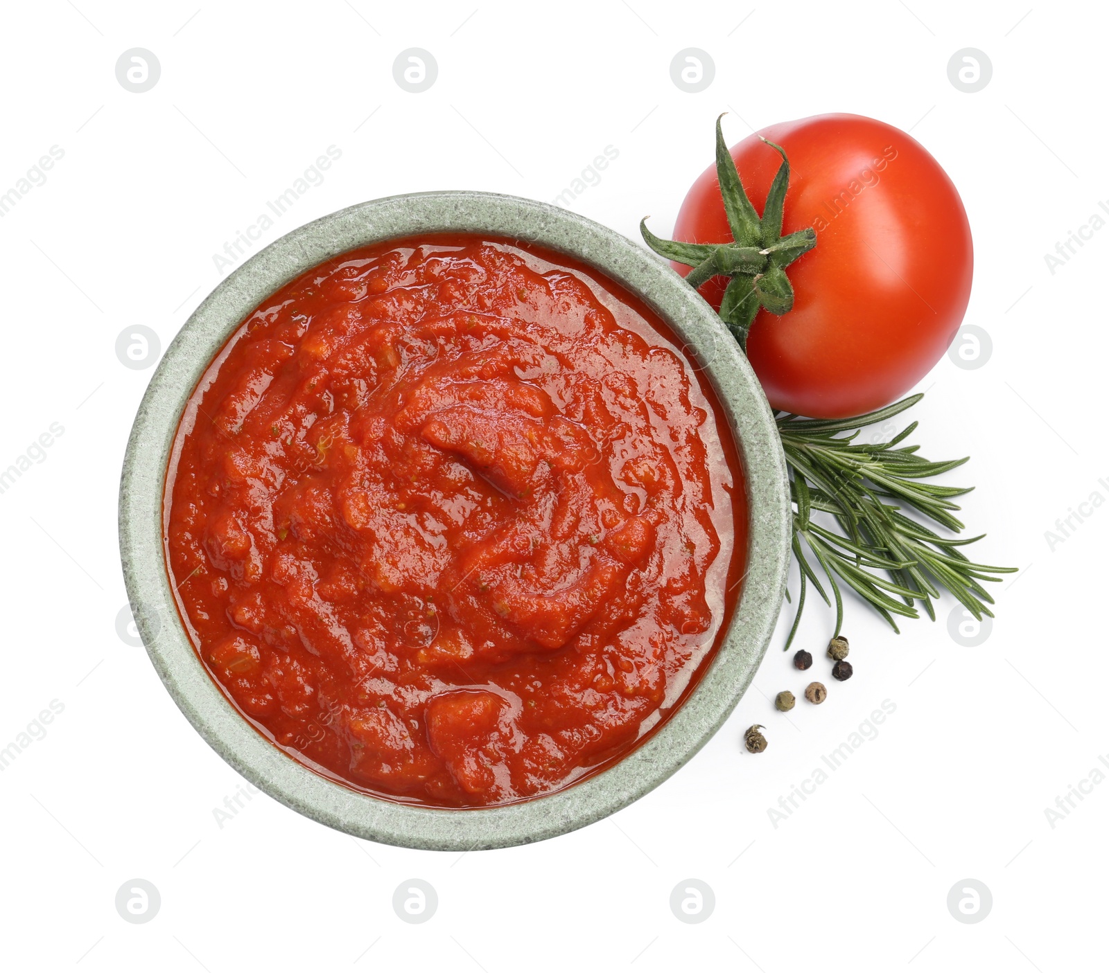 Photo of Homemade tomato sauce in bowl and fresh ingredients isolated on white, top view