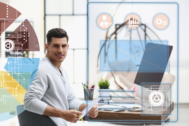 Image of Male designer working at desk in office and digital schemes. Double exposure