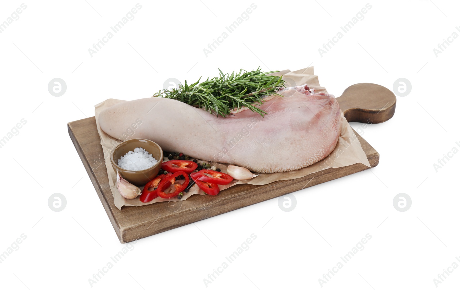 Photo of Board with raw beef tongue and products on white background