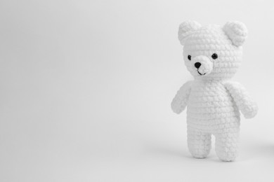 Photo of Cute crocheted bear isolated on white. Children's toy