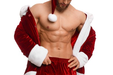 Photo of Young man with muscular body in Santa costume on white background, closeup