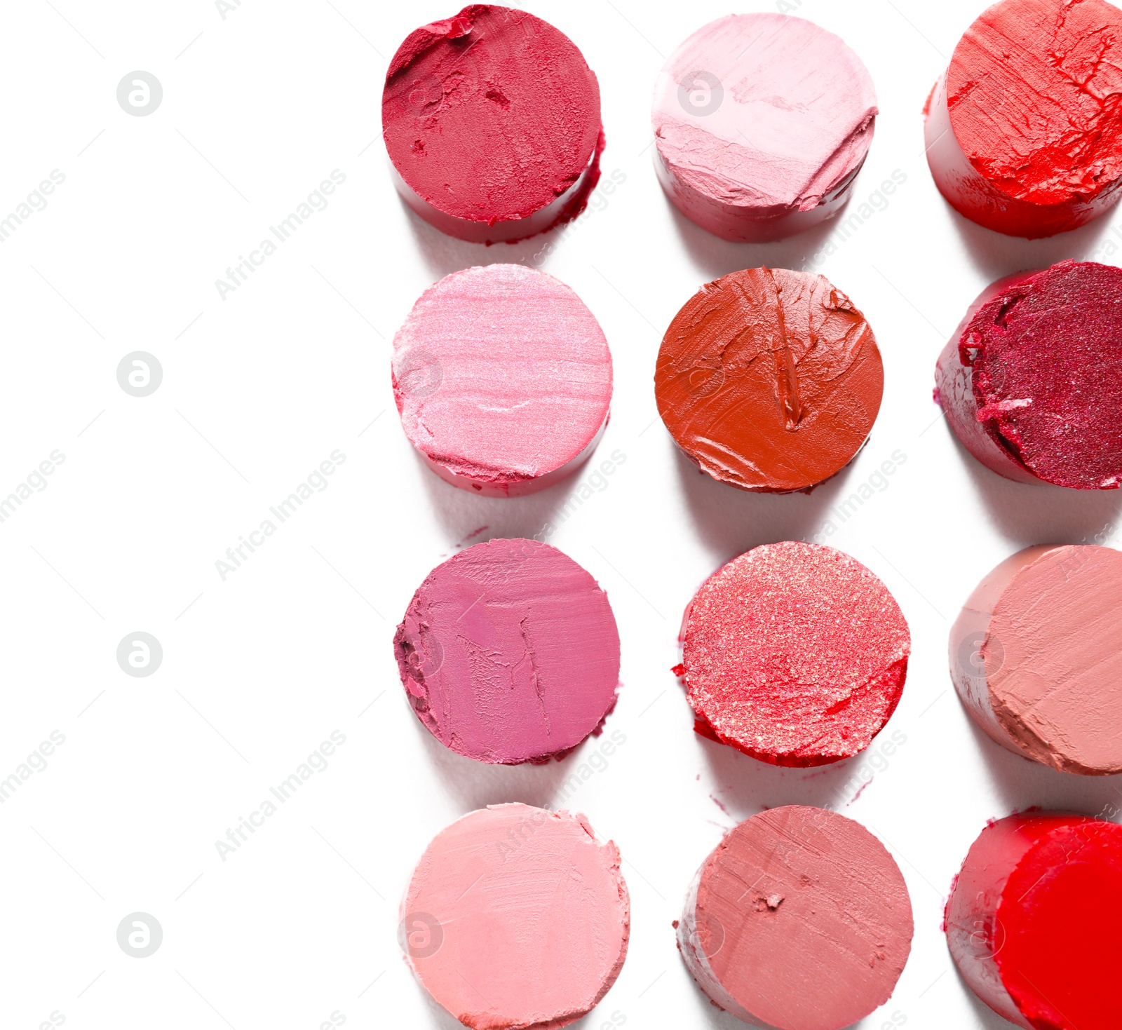 Photo of Different lipstick swatches on white background, top view