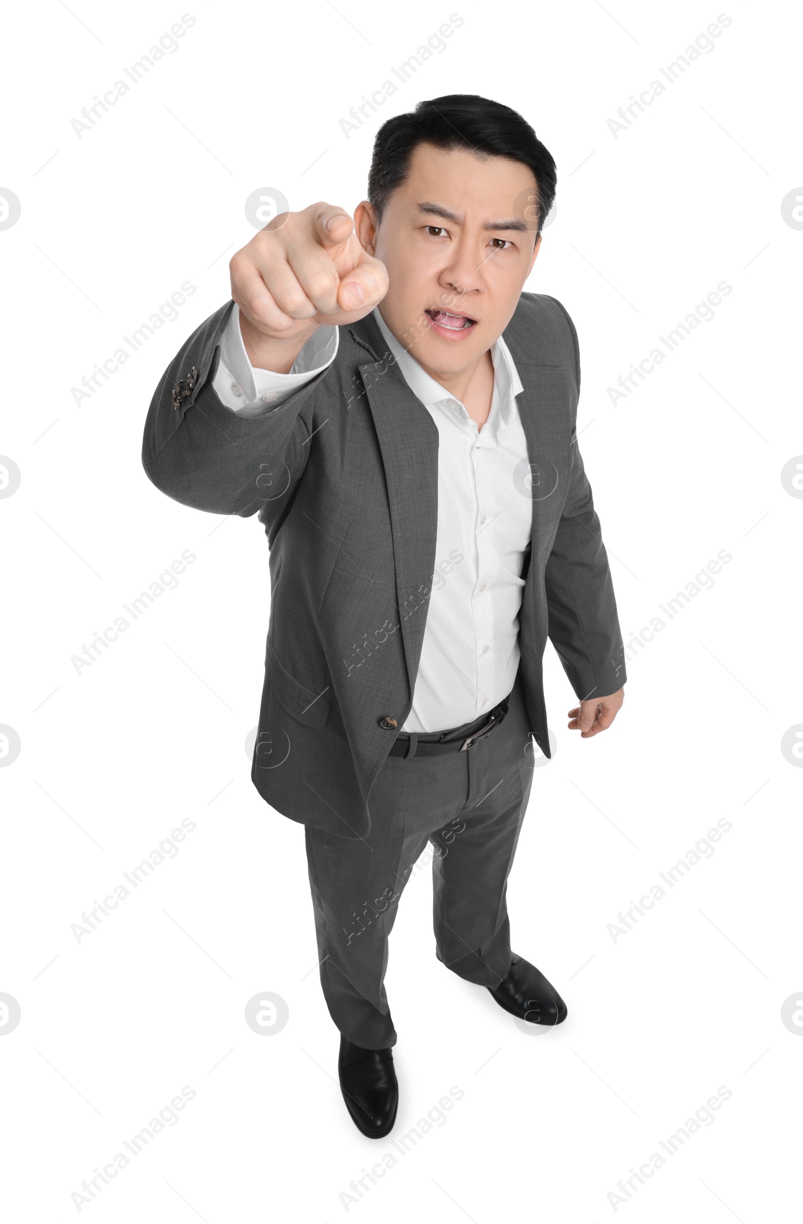 Photo of Angry businessman in suit posing on white background, above view