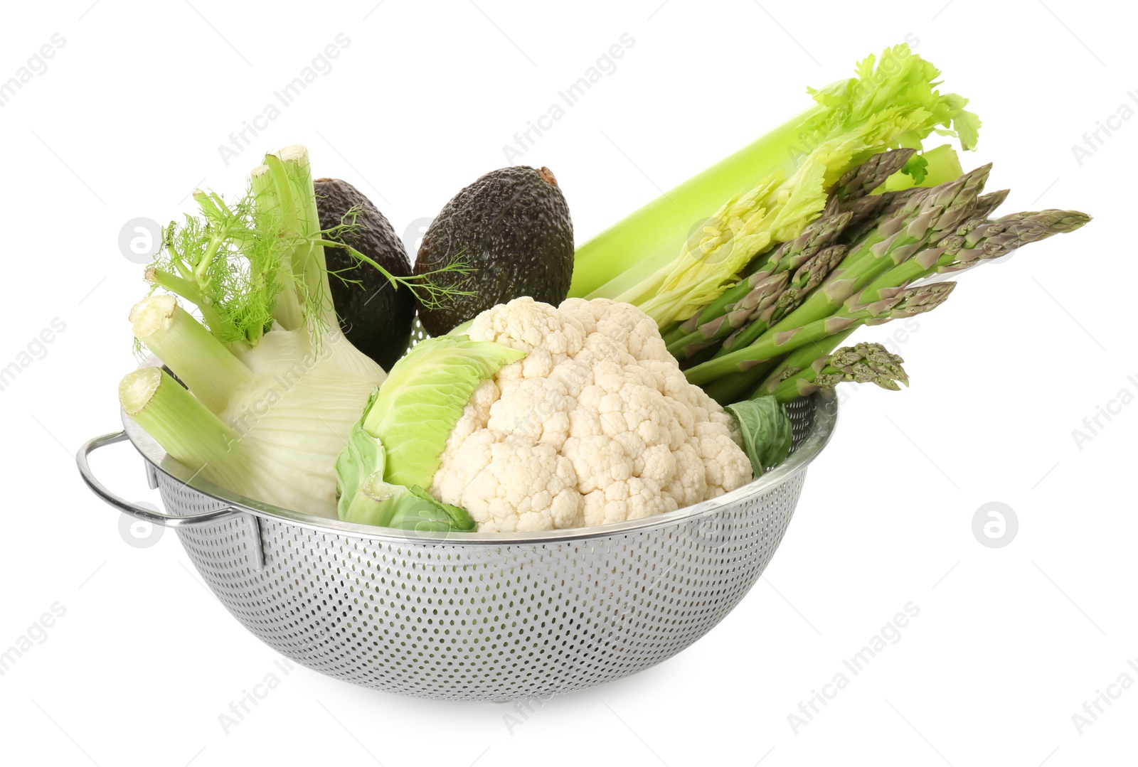 Photo of Metal colander with different vegetables and avocados isolated on white