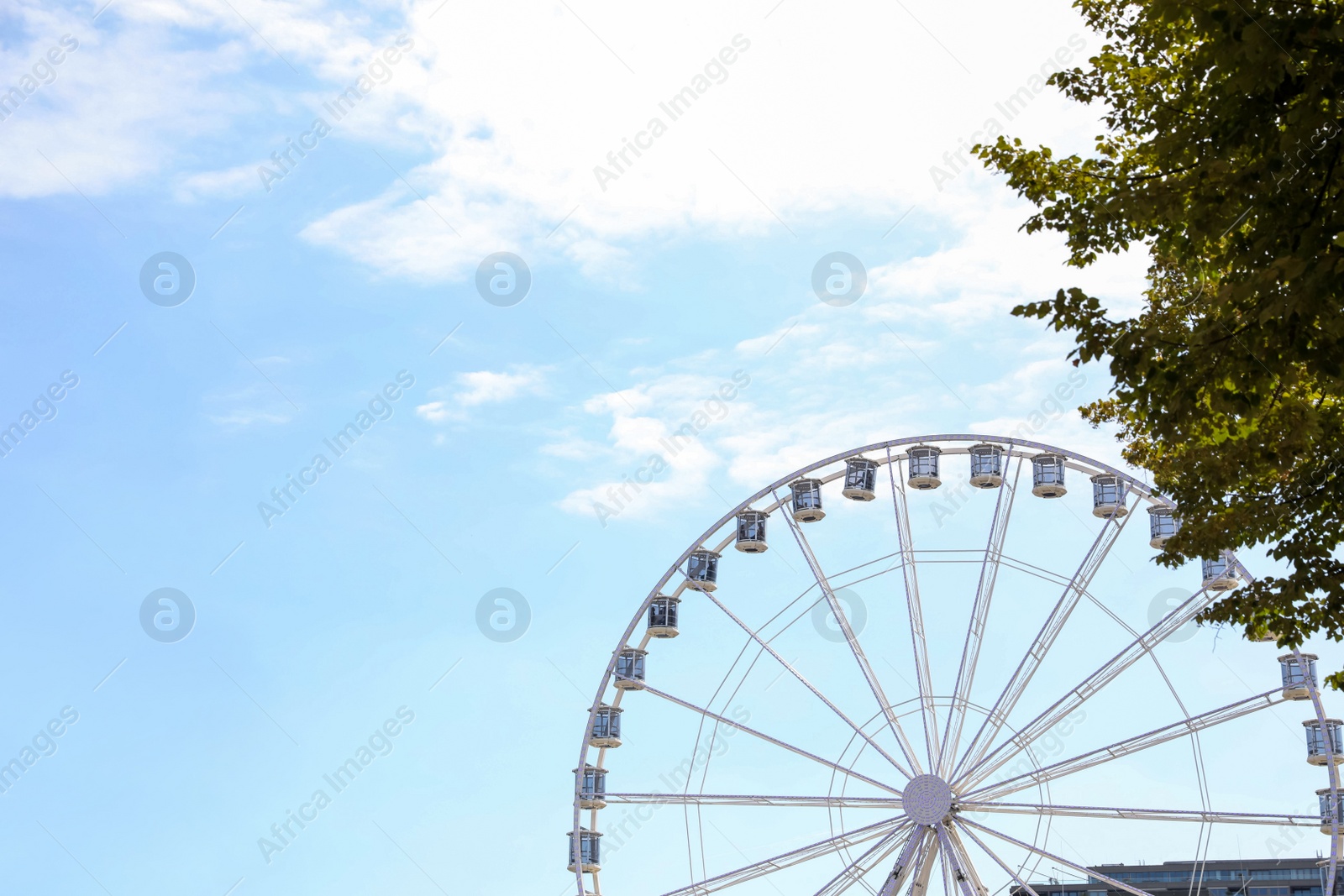 Photo of Picturesque view of beautiful Ferris wheel in city, space for text