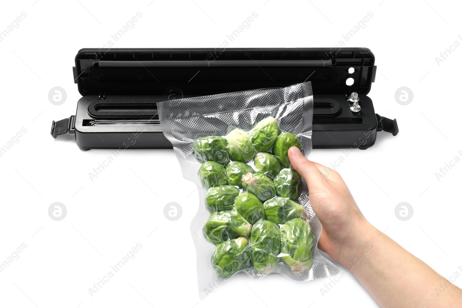 Photo of Woman with vacuum pack of Brussels sprouts on white background, closeup