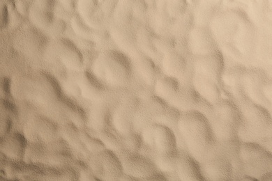 Photo of Dry beach sand as background, top view