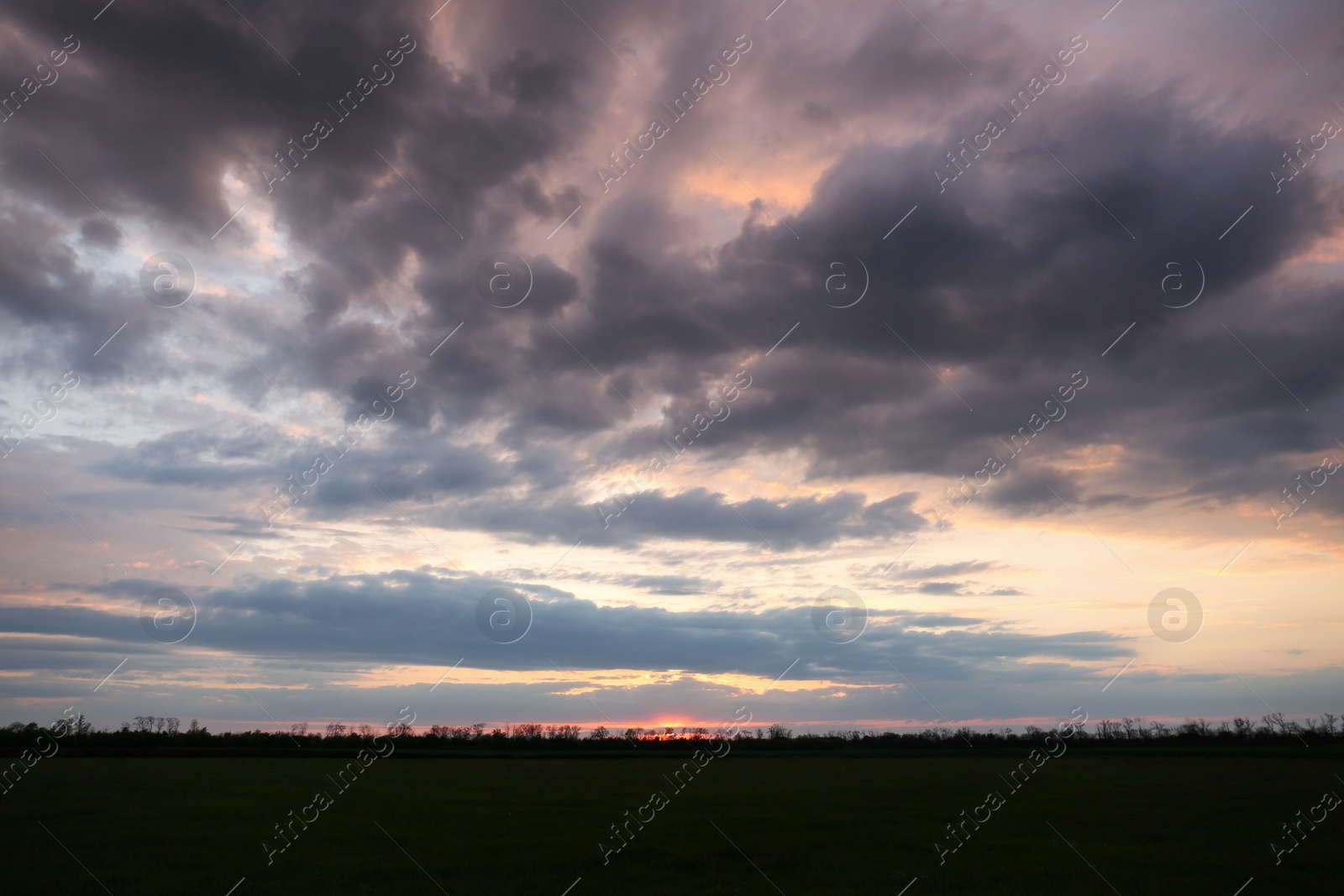 Photo of Picturesque view of beautiful countryside at sunset