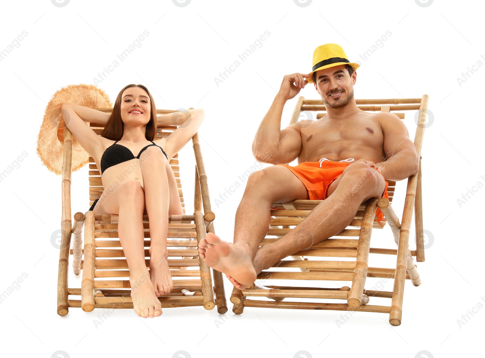 Photo of Young couple on sun loungers against white background. Beach accessories