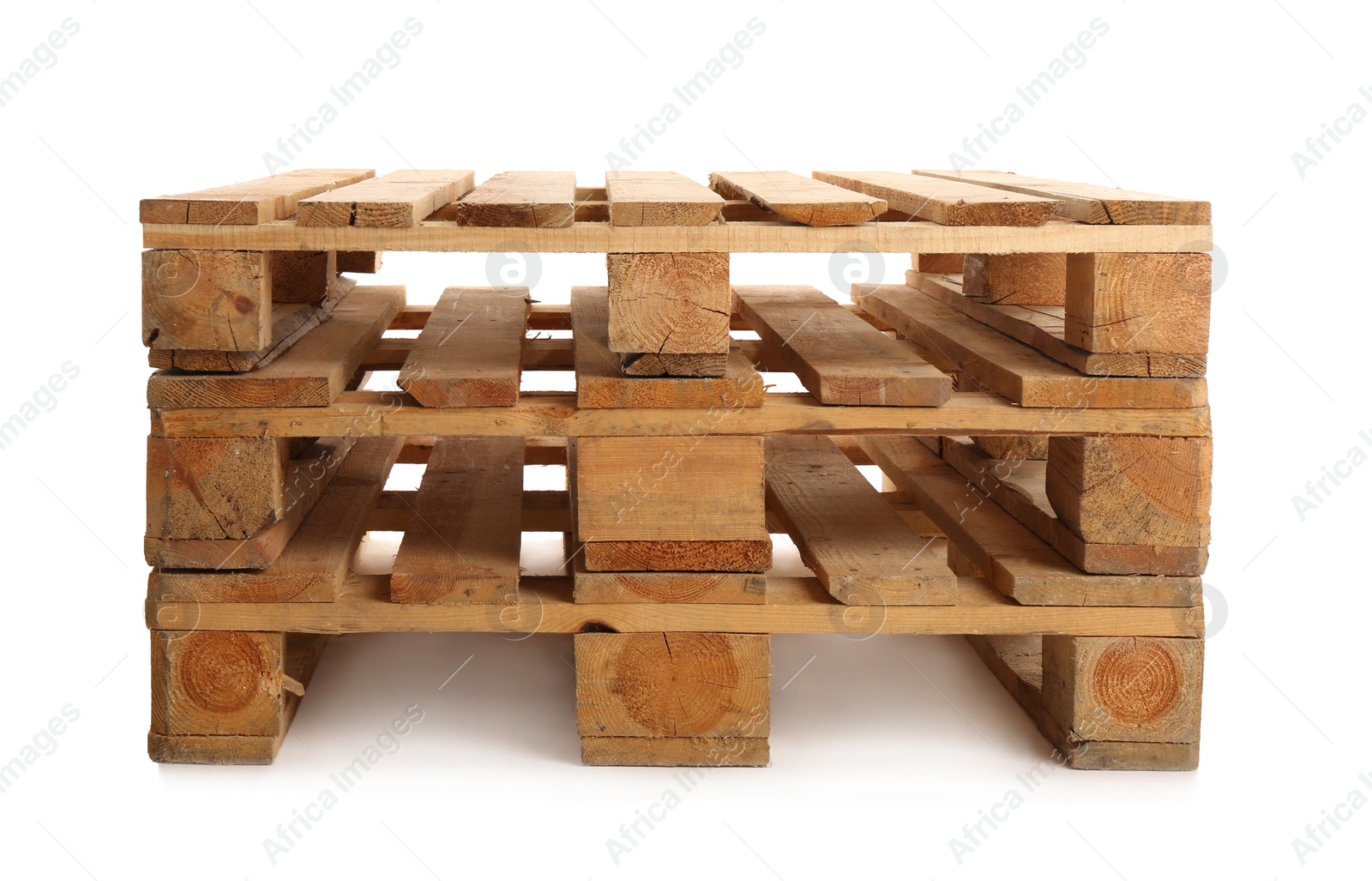 Photo of Stacked wooden pallets isolated on white. Transportation and storage