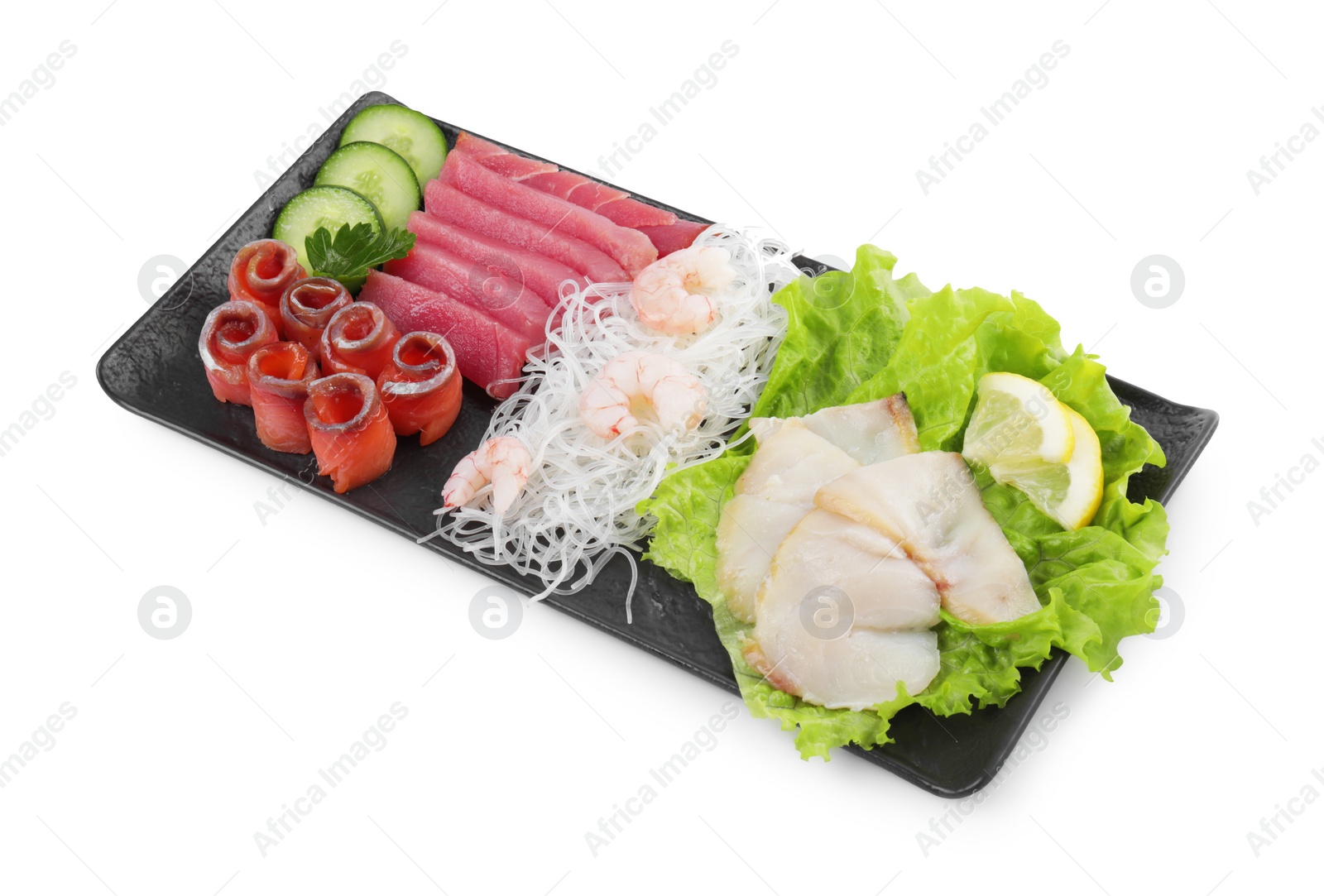 Photo of Sashimi set (raw slices of tuna, oily fish, salmon and shrimps) served with cucumber, funchosa, lettuce and lemon isolated on white