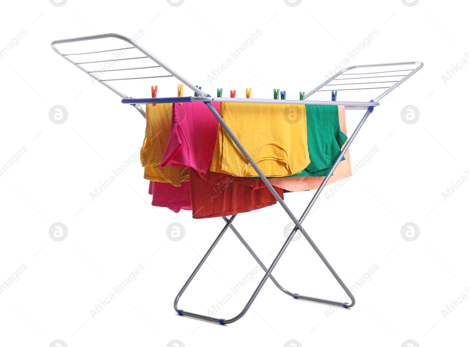 Photo of Clean laundry hanging on drying rack against white background