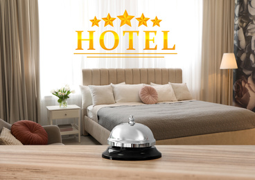 5 Star hotel. Reception desk with service bell and view of luxury bedroom on background