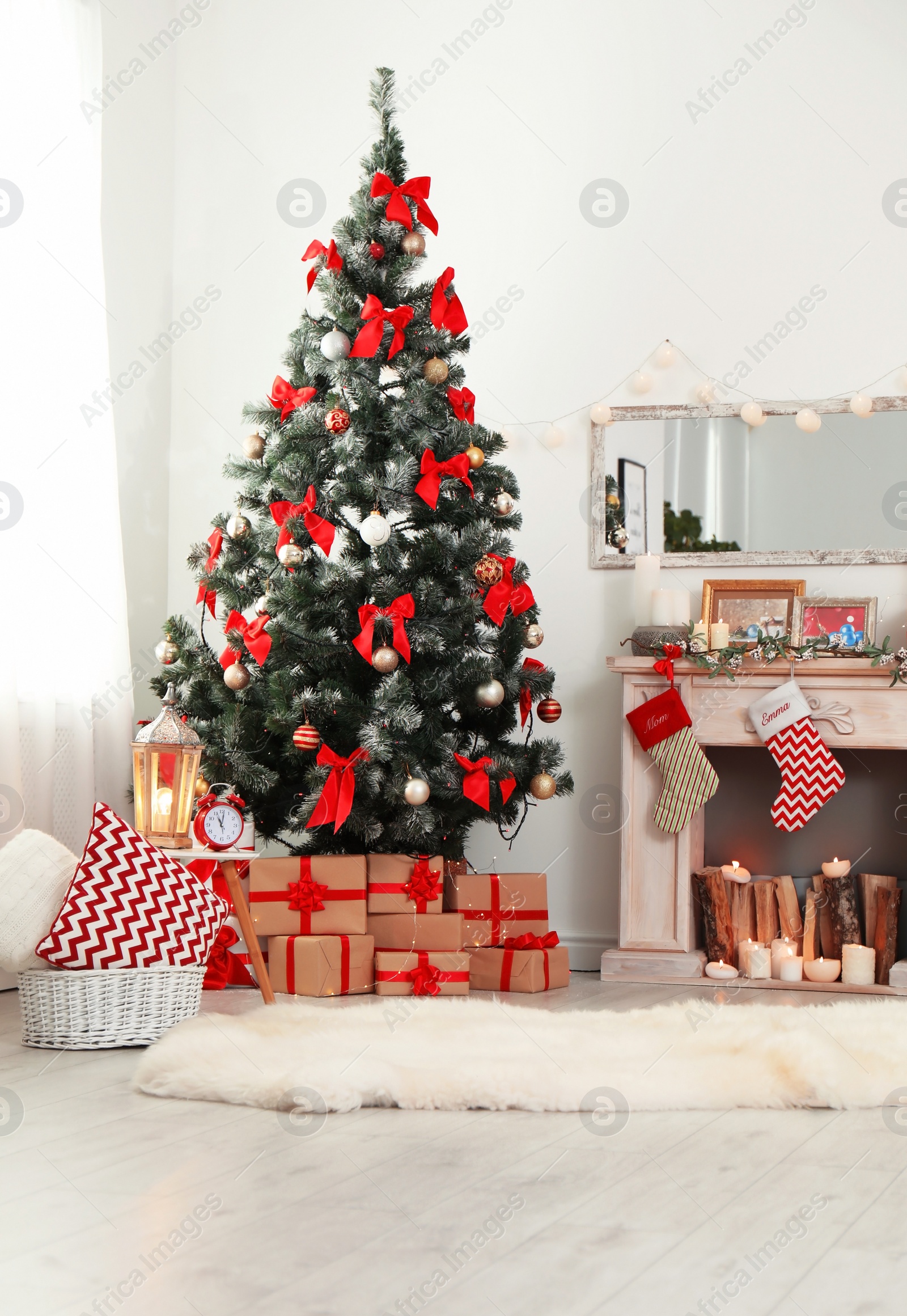 Photo of Stylish living room interior with decorated Christmas tree