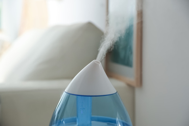 Photo of Modern humidifier indoors, closeup view. Home appliance