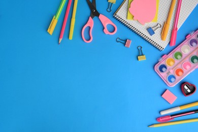 Photo of Flat lay composition with notebook and other school stationery on light blue background, space for text. Back to school