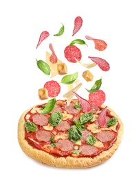 Image of Delicious pizza and flying ingredients on white background