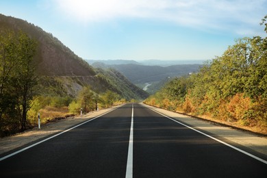 Empty asphalt road in mountains. Picturesque landscape