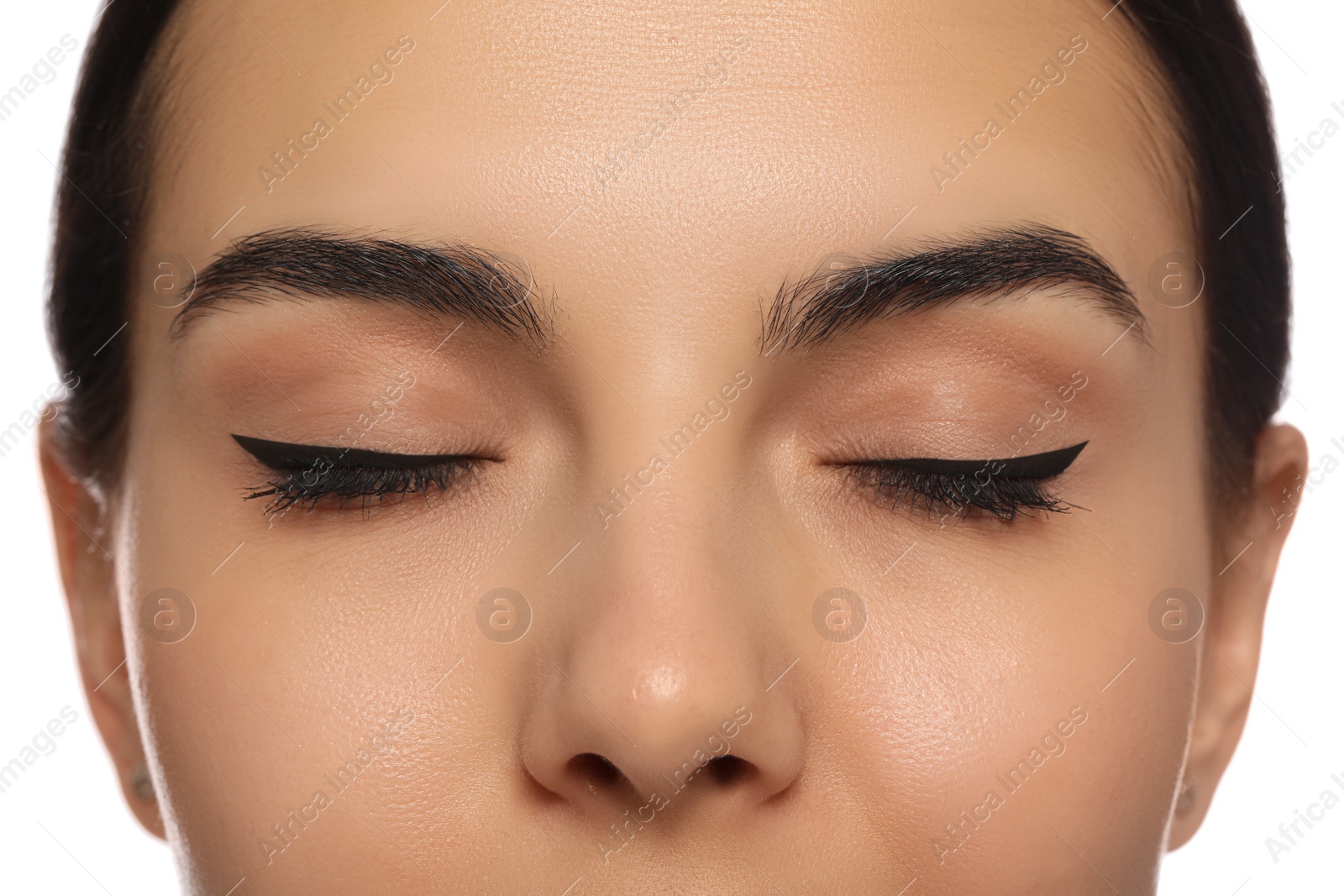 Photo of Young woman with permanent eyeliner makeup on white background, closeup