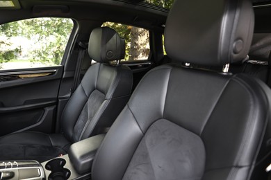 Photo of Clean leather seats inside of modern black car