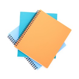 Photo of Many different notebooks isolated on white, top view. School stationery