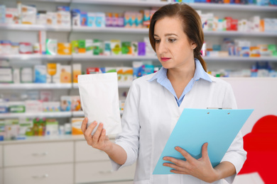 Image of Professional pharmacist with clipboard and prescription in modern drugstore
