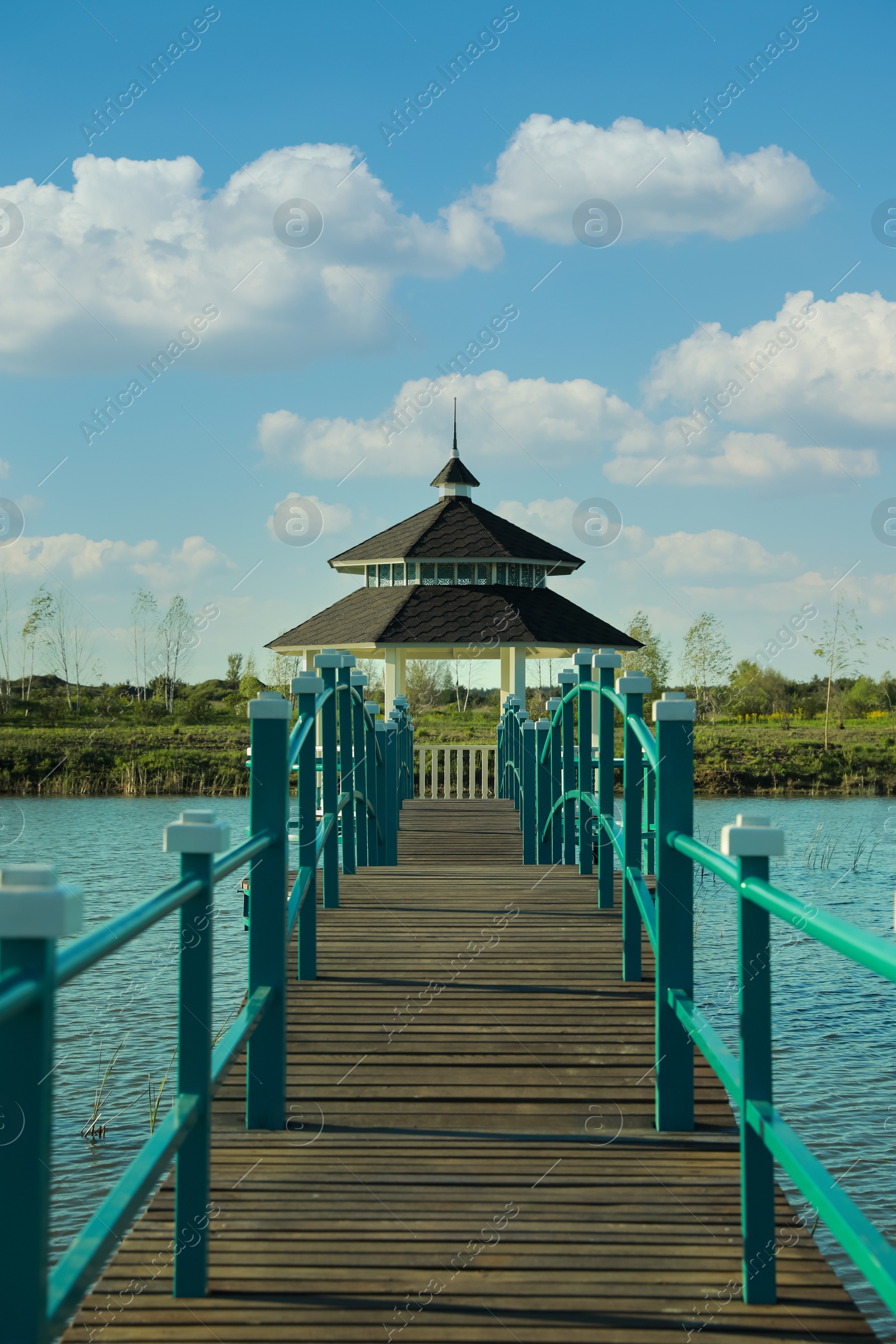 Photo of Beautiful view of bridge and gazebo on lake