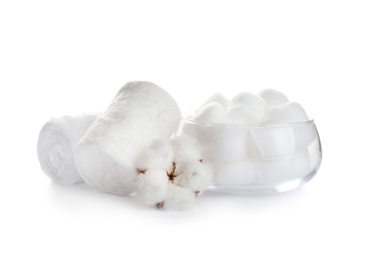 Fluffy cotton rolls, balls and flower on white background