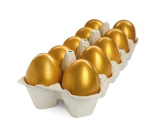 Photo of Many shiny golden eggs in carton on white background