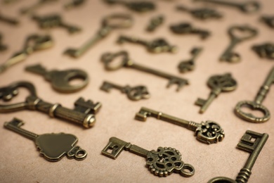 Photo of Old vintage keys on craft paper, closeup