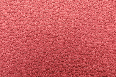 Texture of pink leather as background, closeup