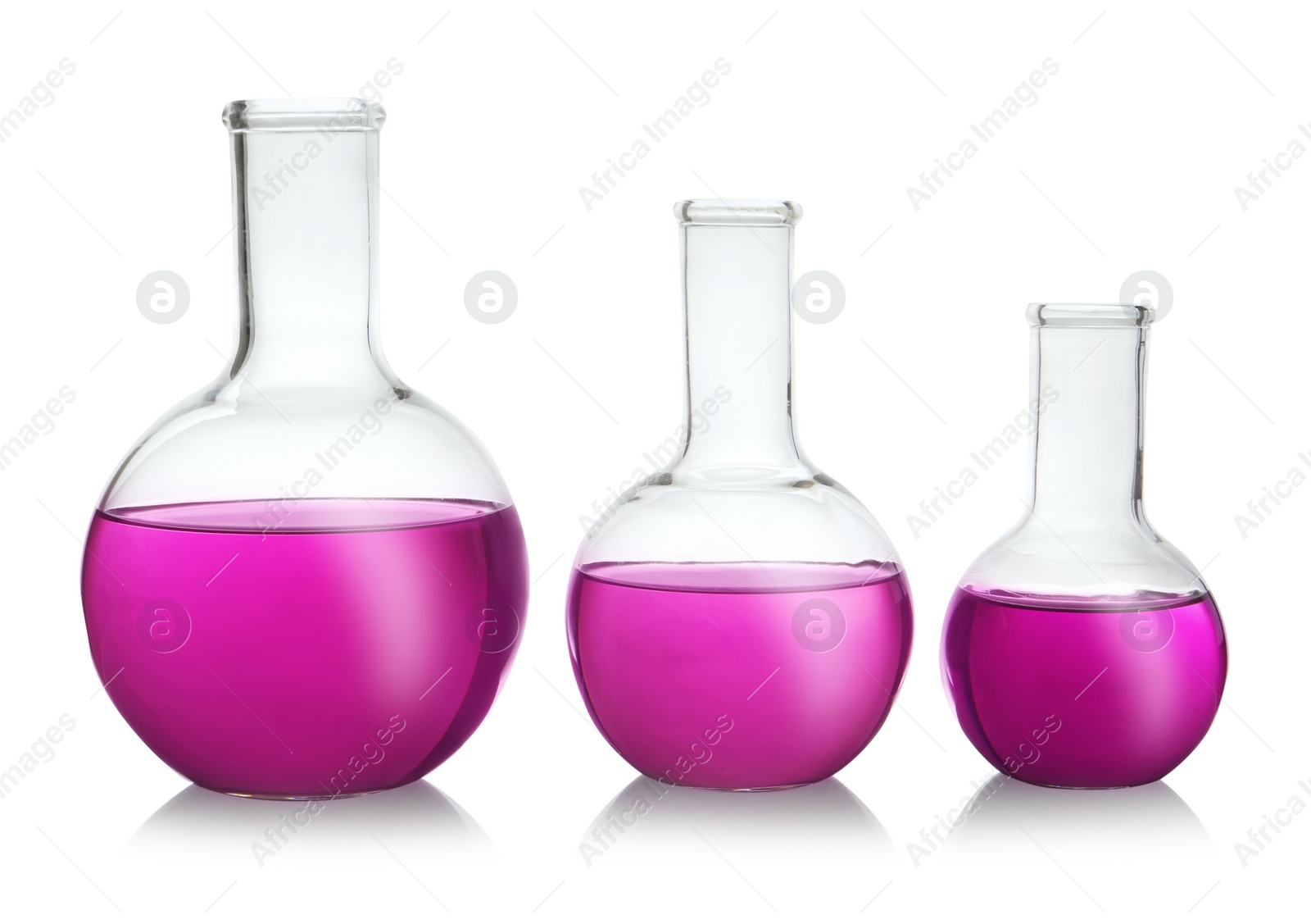 Photo of Florence flasks with purple liquid on white background