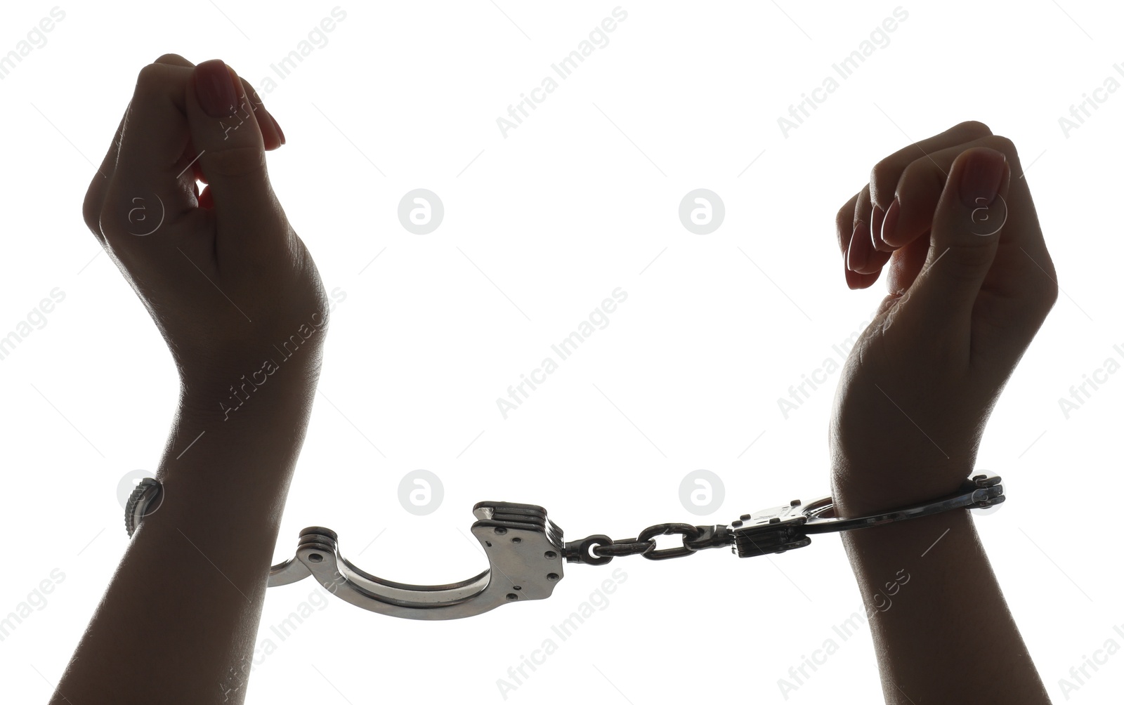 Photo of Freedom concept. Woman with handcuffs on white background, closeup