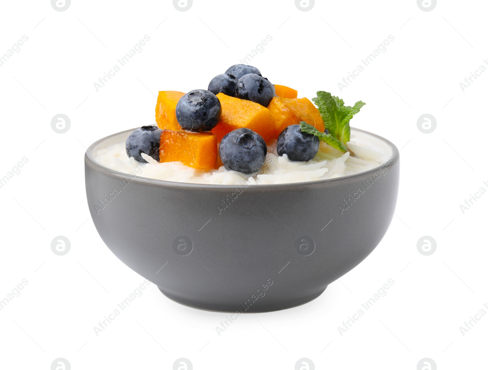 Photo of Delicious rice porridge with blueberries and pumpkin isolated on white