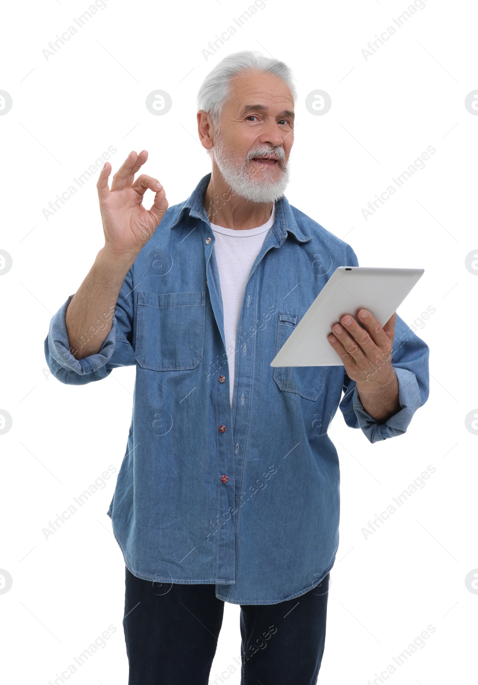 Photo of Man with tablet showing ok gesture on white background