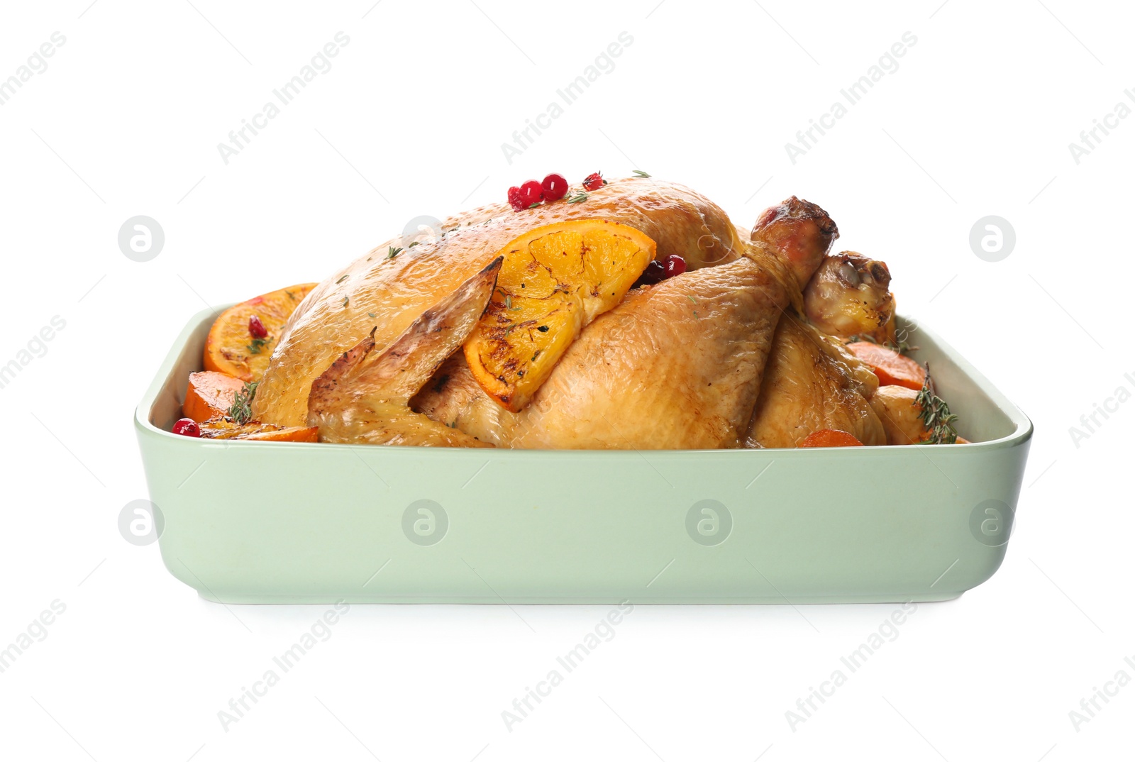 Photo of Roasted chicken with oranges isolated on white