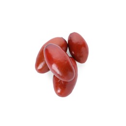 Heap of ripe red dates on white background, top view