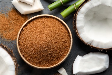 Photo of Flat lay composition with natural coconut sugar on grey table