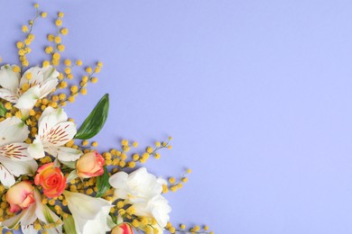 Photo of Beautiful floral composition with mimosa flowers on light blue background, flat lay. Space for text