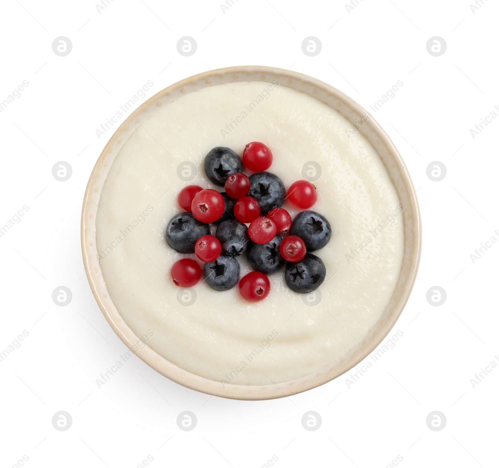 Photo of Delicious semolina pudding with berries isolated on white, top view