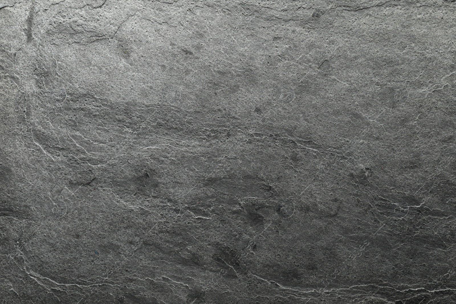 Photo of Gray textured surface as background, top view