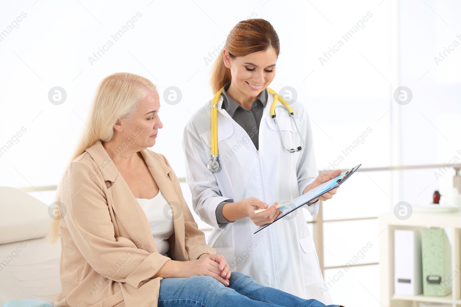 Photo of Doctor working with mature patient in hospital